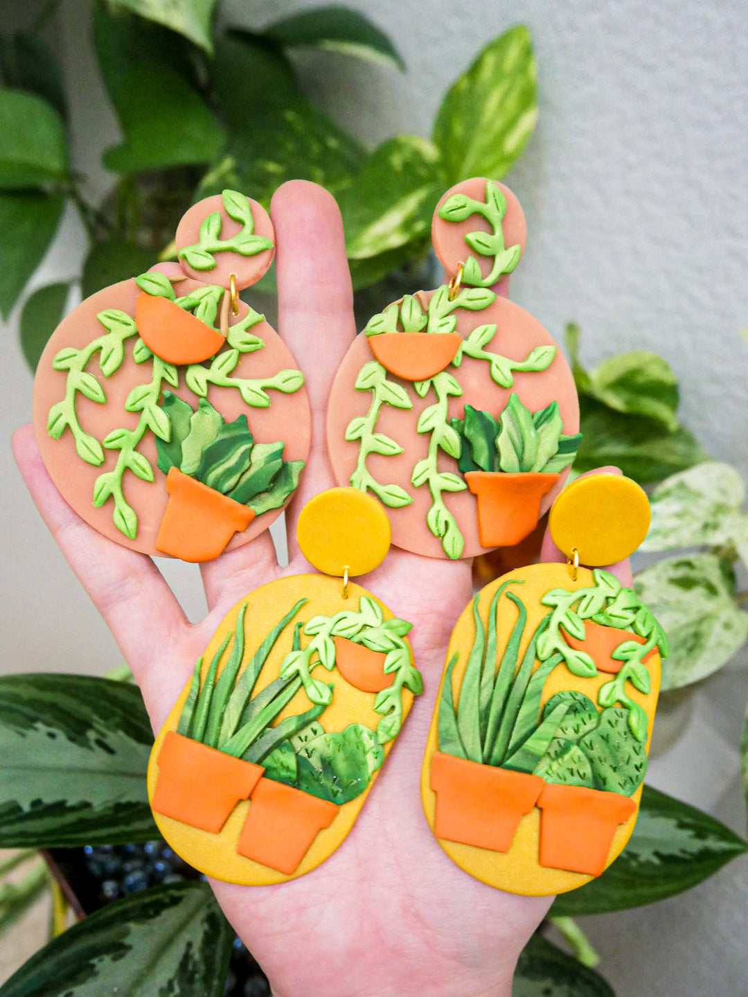 Handmade polymer clay plant earrings.