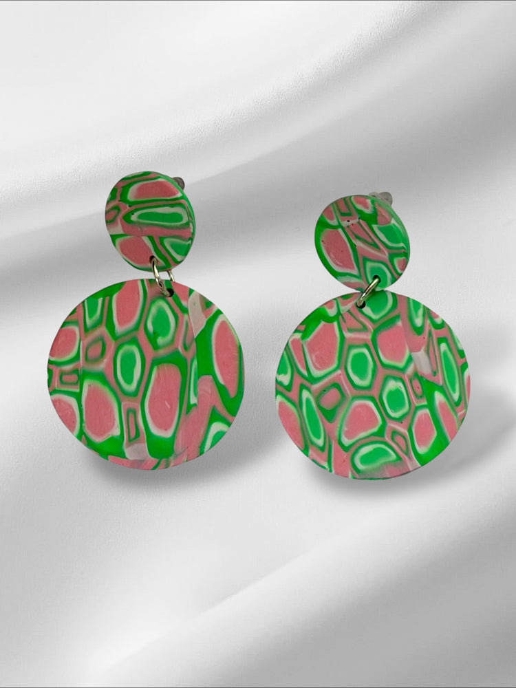 Colorful patterned earrings on a white background